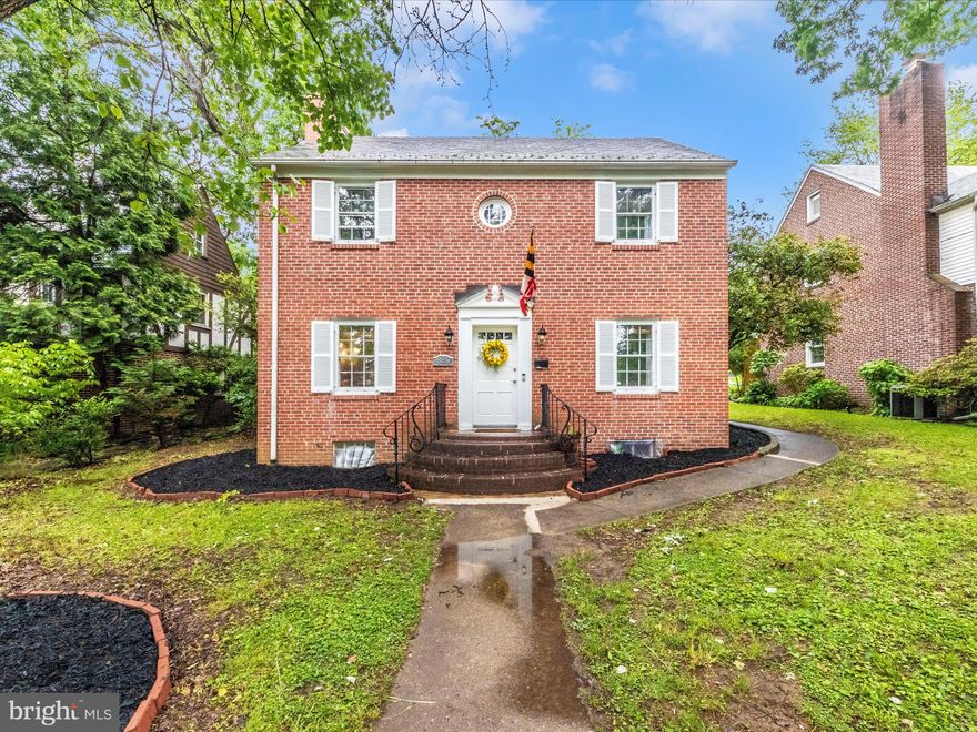 This handsome and stately all-brick Colonial, built in 1955, is perfectly situated on a tree-lined street and offers timeless elegance and modern comfort. Step inside to discover gleaming hardwood floors throughout. The spacious living room is graced by a classic fireplace and elegant crown molding, with easy access to the rear patio for seamless indoor/outdoor living and entertaining. The large formal dining room is perfect for gatherings, featuring chair rail, crown molding, and two built-in china closets for showcasing your finest dinnerware. The heart of the home, the kitchen, is a chef's delight with stainless steel appliances and granite countertops.

Upstairs, you'll find three generously sized bedrooms. The Primary Bedroom is a private retreat, boasting a powder room and an expansive walk-in closet. The second bedroom offers a unique bonus: a staircase leading to a cavernous and well-insulated attic, providing abundant storage possibilities.

The finished basement expands your living space with a large Recreation Room, perfect for relaxation or play, and another full bathroom complete with a luxurious jetted soaking tub. The utility/laundry room provides additional storage and convenient walk-up access to the private backyard. Peace of mind is ensured with a sump pump and waterproofing system. The large and private backyard with its inviting patio is ideal for outdoor enjoyment.

Welcome to Hunting Ridge, a sought-after and historic neighborhood nestled near the stunning treed canopy of Gwynns Falls Park, one of the nation's largest urban forests. Located in Hunting Ridge, a CHAPS-designated historic district, this home offers a unique blend of history and convenience. Enjoy an easy commute to downtown Baltimore and the charming shops and restaurants of Catonsville. With I-95, the Baltimore Beltway, I-70, BWI Thurgood Marshall Airport, Amtrak, and MARC train all within easy reach, this location truly offers unparalleled accessibility.