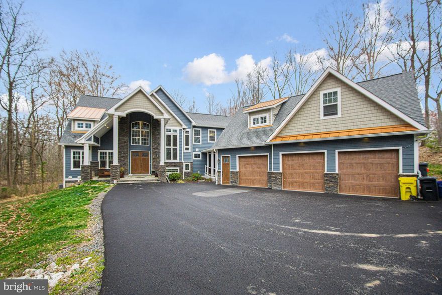 *Back on Market due to buyer financing falling * Additional 1.36 acres (Wrighton Rd) will convey w/ the sale making the total acreage 4.97.  Do not miss the opportunity to purchase this stunning never on the market before, custom craftsman **main level bedroom w/ elevator!!**home sitting on just under 5 acres of gorgeously private land (additional lot to convey).  Located walking distance to Jug Bay Wetlands Sanctuary and minutes from Route 4 for an easy commute to Andrews AFB, D.C., or Annapolis!  Home features an extraordinary amount of living space w/ nearly 6,000 square feet above grade and the opportunity to improve & add value via the unfinished basement which features another 3,000 sqft below grade, 12' ceiling, and 3 rough-ins.  In addition, the home features a 3-car detached garage w/ additional living space perfect for private office space.  Upgrades include: Elevator, sprinkler system, generator, stainless steel appliances, cathedral ceilings in foyer, rear bump out from kitchen, propane heat/oven, recessed lighting, hardwoods entire main and upper level, balcony & spa room off primary BR, composite decking, gourmet kitchen, 4  hvac zones, 2 dishwashers on property, and more! Home has 4 zones (propane heat/AC) in the main house (2 on main level, 1 upper lvl, and 1 in basement). Mini split in garage/apartment (2 upstairs and 2 downstairs).  $12k paved driveway completed 2023 just prior to listing home.