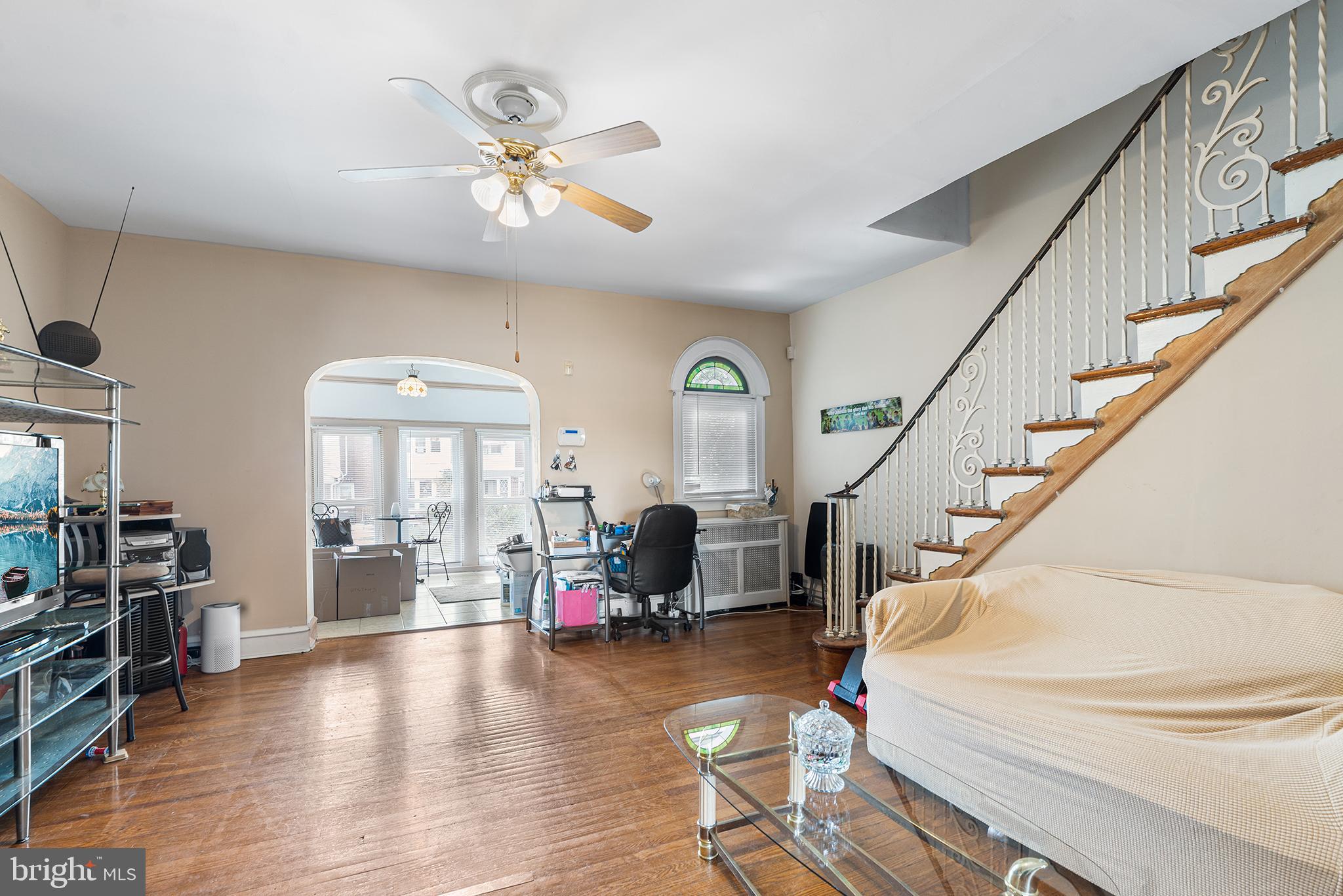 Welcome to this charming home that sits on a quiet block. This updated, move-in ready 4-bedroom, 1-bathroom two-story row house is prepared for you to make it your home. With an interior space of 1336 square feet, it features a bright and neutral color scheme. The recently renovated kitchen includes pristine gray shaker cabinets, new counter tops and ample storage and preparation space. The spacious living room and adjacent dining room facilitate easy entertainment and a mini split to keep you cool on those hot summer days. A new deck off the dining area that is great for entertaining or to sip your morning coffee. The second floor comprises three bedrooms and one bathroom, all with hardwood flooring. The finished basement accommodates the laundry area and offers additional storage and living spaces. A fourth bedroom, entertainment or a play area for the little ones. Additionally, there is an attached single-car garage providing ample storage. The property is conveniently located near shopping centers with easy access to major highways and public transportation.