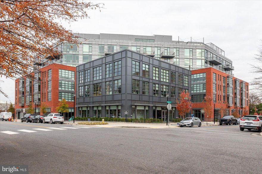 PRICE REDUCED! MOTIVATED SELLER! Buyer backed out for personal reasons.
A MUST SEE! Experience the epitome of luxury living at MUSE, Old Town Alexandria’s award-winning condominium building, perfectly situated in the heart of the vibrant Arts District. This chic and sophisticated two-bedroom, two-bathroom residence offers breathtaking panoramic river views and an exceptional lifestyle.
Step into a bright and spacious home featuring floor-to-ceiling windows, wide-plank hardwood floors, and recessed LED lighting throughout. The sleek chef’s kitchen boasts paneled appliances, Italian cabinetry, quartz countertops, and a central island with deep drawer storage, counter seating, and a wine refrigerator. The balcony, accessible from the living room, offers sweeping river views. The luxurious owner’s suite is a private retreat, complete with two customized walk-in closets, and a spa-like bathroom featuring marble tile, a double vanity, LED backlit mirrors, and a discreet water closet. A second bedroom offers ample closet space and is complemented by another beautifully appointed full bathroom. Additional conveniences include a dedicated in-unit laundry room. A separate storage space and two assigned garage parking spaces convey.
MUSE provides unmatched amenities designed for an elevated lifestyle. Enjoy a full-service 24-hour concierge, an on-site manager, and a building engineer to meet your every need. The rooftop clubroom offers spectacular views of the DC Monuments, Potomac River, and Old Town skyline, with indoor and outdoor spaces perfect for entertaining or relaxing. The penthouse-level fitness and yoga studios, complete with cutting-edge equipment and an outdoor fitness terrace, provide plenty of options to stay active. With direct access to the Mount Vernon Trail and a prime location just minutes from DC, MUSE is the ideal blend of convenience, luxury, and modern living. Make this extraordinary waterfront home your own.
Square footage is approximate and per floor plan. Monthly condo fee is $1,569.63. Additional monthly fee of $60 for two parking spaces.