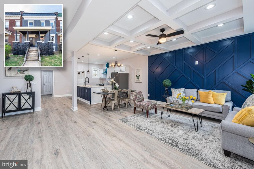 BEYOND SPECTACULAR 24 FT. WIDE RENOVATION WITH OVER 2,500 SQ. FT. OF LIVING SPACE!  Open floor plan featuring wood flooring throughout the main level, a spacious living room with coffered ceiling and designer accent wall, gourmet island kitchen with ss appliances & Quartz counters, a generously sized Primary bedroom with a sitting room, private deck, and full bath with a double sink and large walk-in shower, a fully finished basement with a family room, bedroom, and a 3rd full bath, and a rear fenced yard!  Pack your bags and move right in!