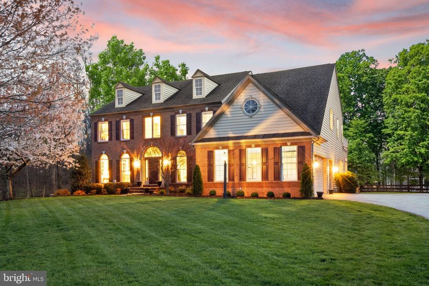 This is the kind of home buyers hope hits the market, and rarely does.

Set on nearly 3 acres in one of Haymarket’s most peaceful, tree-lined settings, this property delivers something that’s getting harder to find: true privacy, natural beauty, and space, without sacrificing convenience. Tucked into the sought-after Carolina Chase community and backing to conservation, it feels like a hidden retreat while still being minutes to Route 66, Route 15, Route 29, shopping, and dining.

Inside, the home opens with a light-filled two-story foyer and a warm, inviting layout designed for both everyday living and entertaining. The family room with brick hearth, sun-filled living spaces, and views of mature trees from nearly every window create a setting that just feels different.

The kitchen has been updated with modern finishes, and the fully finished basement (2024) adds flexible space for guests, entertaining, or a private retreat, including a theater room setup. Five bedrooms, expansive square footage, and thoughtful layout provide room to grow without compromise.

What truly sets this home apart is what buyers can’t always see: the major systems and investments already completed. 3-zone HVAC replaced (2020, 2021, 2024), hot water heater (2023), sewer system upgrade (2023), sump pump (2025), new master bedroom windows (2025), and slate patio (2025).

Outside, the fully fenced backyard, mature landscaping, and usable acreage create a setting that feels private, quiet, and complete, the kind of outdoor space buyers are actively searching for but rarely find at this level.

Homes like this, combining acreage, setting, updates, and location, don’t come up often in Haymarket. And when they do, they don’t last.