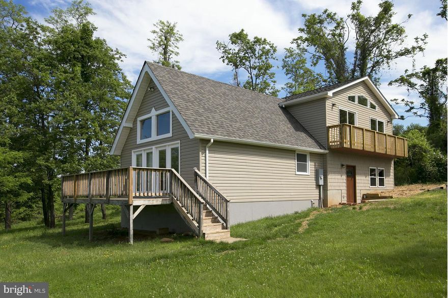 Adorable floor plan on incredible lot w amazing views. Vaulted ceilings with exposed beams. Tiled showers & wood accents throughout. Great room with balcony & loft area/3rd BR. Every room has a view! Tucked away private spaces. Lower lever w unfinished area ideal for future workshop or liv space. Lake access, tennis & more. Great commuter location!