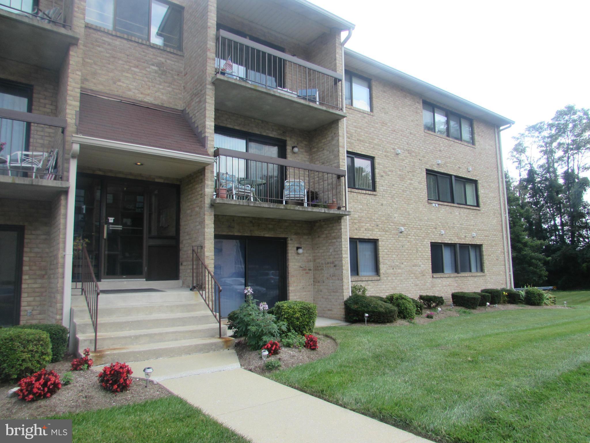 Great location at rear of building overlooking trees + easy steps to unit! Updated kitchen boasts additional cabinets and counter space, all appliances & ceiling fan! Laminate flooring in living and dining rooms with replaced slider to balcony with lovely view. Master suite with neutral carpeting, lighted walk in closet + linen closet, updated full bath with shower!