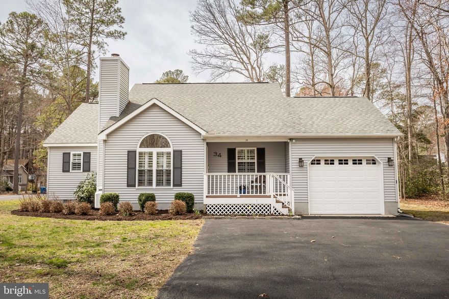 Welcome to this beautifully updated corner lot home in the heart of Ocean Pines.  Entering the home you find a warm and inviting open floor plan living room, dining room and kitchen, perfect for entertaining.  The living room holds a beautiful gas fireplace, the kitchen has been updated with shaker style cabinets, stainless steel appliances and gorgeous granite counter tops.  Off the kitchen you will find an inviting screened in porch that leads to the fenced in backyard which has newly planted trees on the fence line to create privacy.  Back inside, you will find the bedrooms in a split floor plan style, the primary suite exits out onto the screened porch and has its own primary bathroom.  The laundry can be found situated between the other two ample sized bedrooms with a bathroom in the middle.  Upgrades made in the last year are a new garage door, the privacy trees being planted, and the entire interior of the house has been painted.  Schedule your appointment to make this your home sweet home near the beach, shopping, restaurants and all the amenities the HOA offers!