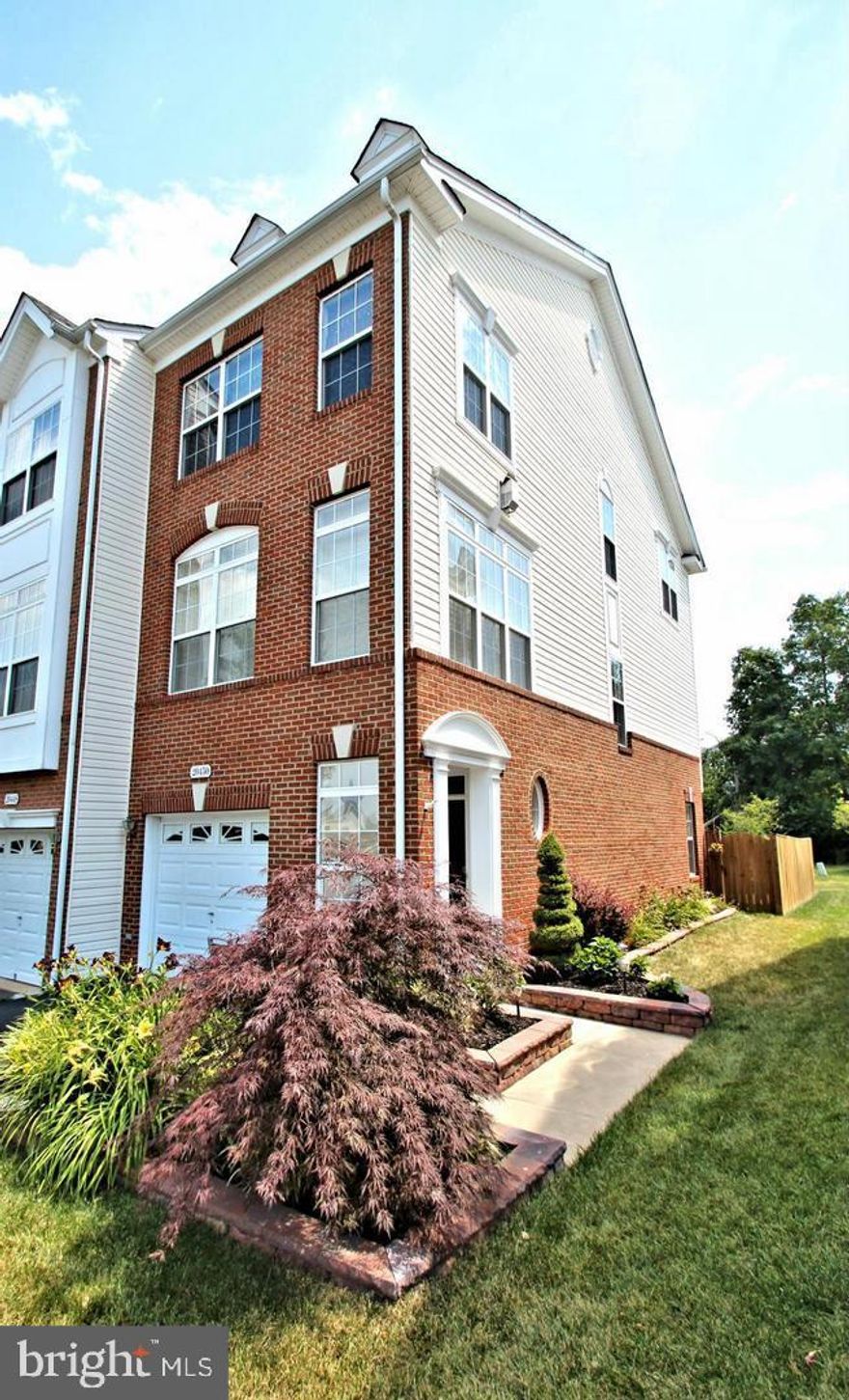 Beautifully landscaped end unit TH with a garage in sought after Belmont Community. 2 large Bedrooms with vaulted ceilings, walk-in closet, updated bathrooms, plantation shutters, hardwood floors, on the main level, gourmet kitchen includes SS appliances, granite counters, 39"+ Maple Cabinets, Tiled Back Splash, private covered side entrance. Walk out basement to paver patio and fenced back yard