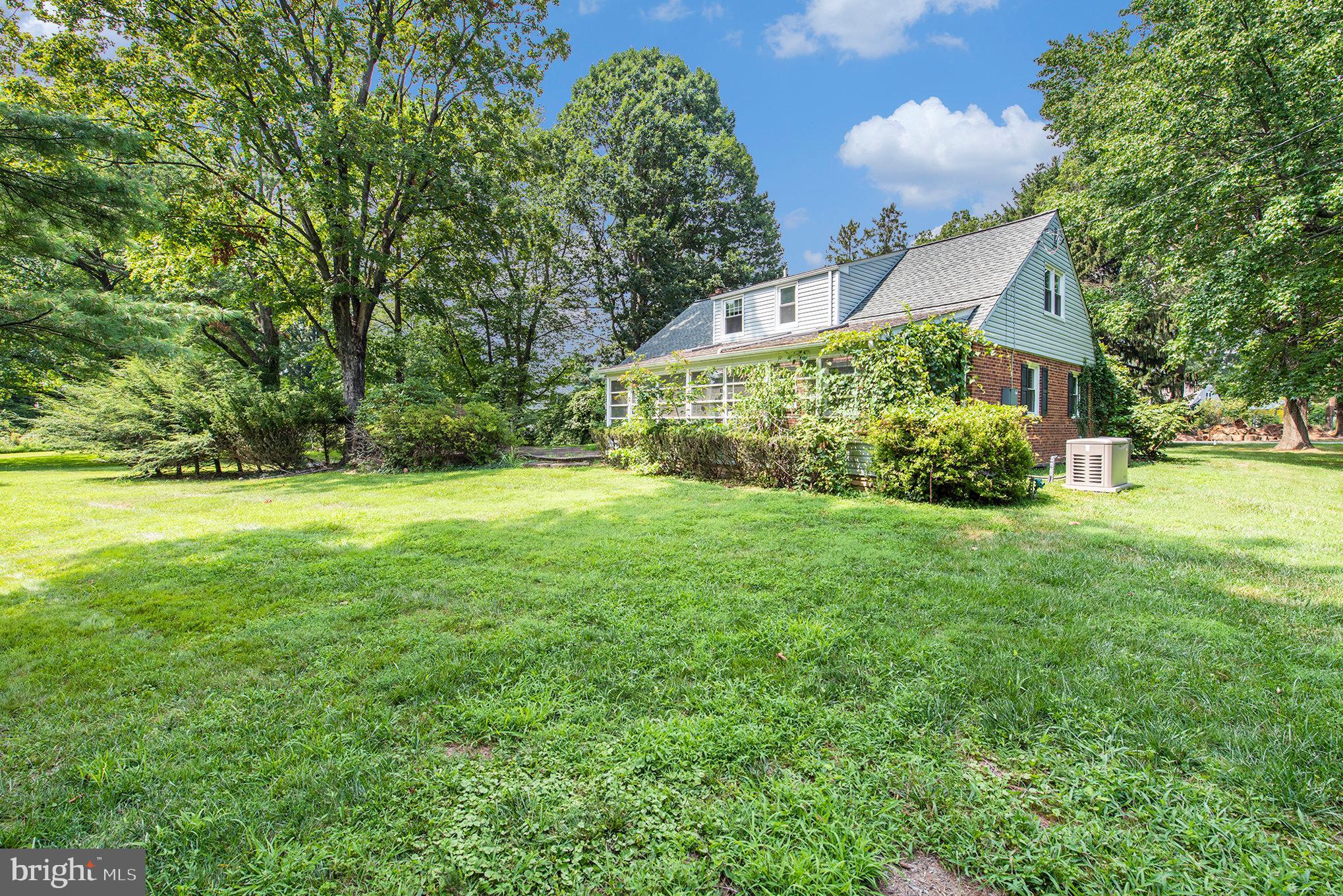 WELCOME to 532 Vista Rd located in the Merrill Hills/Hamilton Park area. This is a solid and well-built 4-BR, 2-bath brick and vinyl siding Cape Cod, full of character and lots of potential, nestled on a beautiful, flat Over 3/4 Acre lot in Lower Gwynedd Twp - only minutes to local schools, churches and to charming, revitalized downtown Ambler where you can enjoy easy access to unique shopping, dining, 2 historic theaters, a public library, and train service to Philadelphia. This classic home offers a sturdy foundation and helpful updates over the years, including replacement windows (2023), roof (2023), oil furnace (2023), A/C, Updated Electric and a back-up Generator (2022), Newer kitchen and bathroom on 1st Flr with two good sized Bedrooms with walkin in closets, also on 1st floor. Home has been very well-loved for many years and offers tremendous promise to a new owner. Inside, you'll find hardwood floors throughout much of the home and a kitchen stainless appliances, a large island and an outside entrance to a Enclosed 3 season room and patio /deck area overlooking the large treed private backyard. The main level also features a Primary BR with a walk-in closet, a 2nd BR and a shared updated Full bath with a tiled shower stall (2022). The 2nd level offers two bedrooms and a shared full bath with tub/shower and newer toilet and vanity that provide additional space and flexibility for family and guests. A partially unfinished basement and floored crawl space, also holds the laundry area with a washer/dryer and laundry tub. It offers plenty of room for storage, and with a possible future renovation could make this a wonderful workout, play or recreation space. There is also a 1-car attached garage for added convenience. With great bones, some recent system upgrades, and a prime location in the L. Gwynedd township area within the well-regarded Wissahickon school district, this lovely home is a rare opportunity to create your dream home in a vibrant community close to major roadways and amenities like: