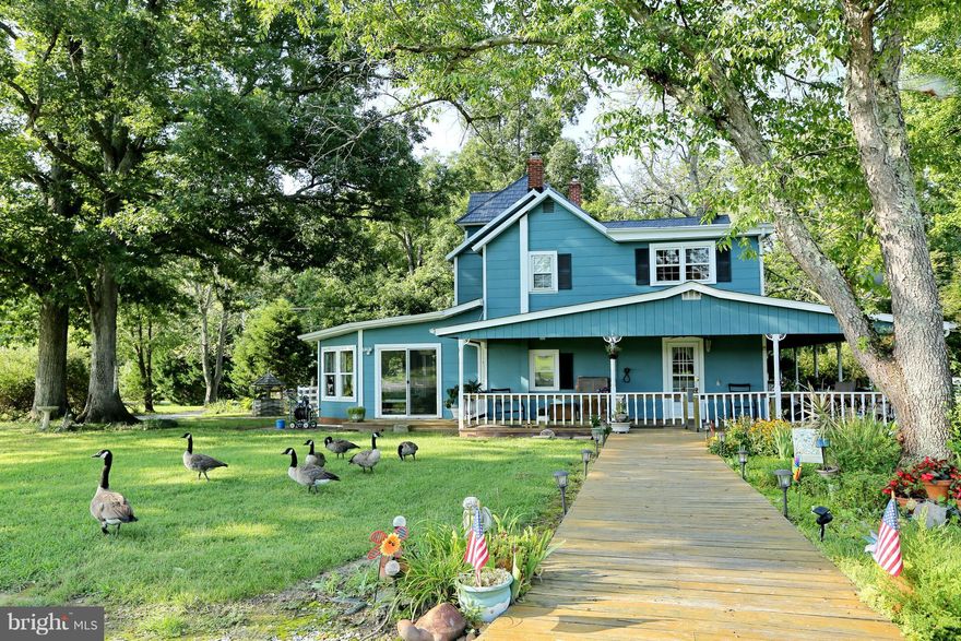 A RARE FIND! Own your own little piece of heaven. Less than an hour from Washington DC. A great farm with renovated farm house on 72+ Acres. Approximately 30 acres cleared, 40 acres wooded with trails for riding. Abundant historical details throughout the house. Relax on the massive wraparound porch & watch the geese on the pond or ride horses through extensive wooded trails. Huge barn, several sheds/out buildings, greenhouse, hot tub, 4 car carport. Escape city life to this wonderful retreat. Schedule a showing today!