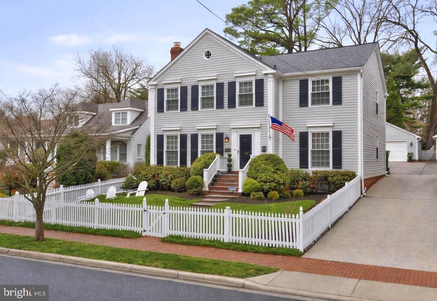 Dreaming of a beautiful home with a white picket fence and olde town charm? Here’s your rare opportunity to own a stunning gem in the heart of Kensington’s Historic District. This highly sought after section of Kensington is beloved for its walkability, neighborly character, and six local parks and playgrounds — all just steps from this magnificent home.​​​​​​​​​​​​​​​​ With five bedrooms, three-and-a-half baths, and oversized two-car garage, this center-hall Colonial is the perfect blend of timeless elegance and modern living, recently transformed through masterful renovations throughout, including new roof, Andersen windows, luxury lighting and ceiling fans, stonework, and so much more. The grand foyer welcomes you to  4000sf of beautifully scaled spaces: the gracious living room with gas fireplace, formal dining room, family room with coffered ceiling, and chef’s kitchen. The kitchen boasts custom cabinetry, granite countertops, high-end appliances, including a Sub-Zero refrigerator with in-drawer icemaker. Bifold French doors frame the family room which is anchored by a magnificent wood-burning fireplace with limestone surround and custom built-ins. The cheery sunroom doubles as the perfect home office, featuring skylights, rattan fandeliers, and custom built-in desk and shelving. A mudroom/butler’s pantry and first-floor Miele washer and dryer add everyday convenience. Upstairs, the luxe primary suite boasts a wall of custom closets and renovated bath, alongside three additional spacious bedrooms, plus a renovated hallway full bath. The finished lower level includes a large bedroom with en suite bath. Rounding out the family-friendly space is a home theatre/family room with egress window, home gym, storeroom with a cedar closet, and a separate custom pantry. The wall-mounted TVs convey with the property, if desired. Outside property features a flagstone patio and fully fenced yard, ideal for outdoor living with year-round foliage and low maintenance landscaping. The separate two-car garage features custom cabinetry, built-in shelving, attic storage, and an EV outlet. Steps from Clum-Kennedy Park, Safeway, shops, restaurants, Noyes Children’s Library, Fitness/Yoga Center, Farmer’s Market, Babycat Brewery, and with easy access to Metro, MARC train, and I-495, this is more than a home. It's a lifestyle.