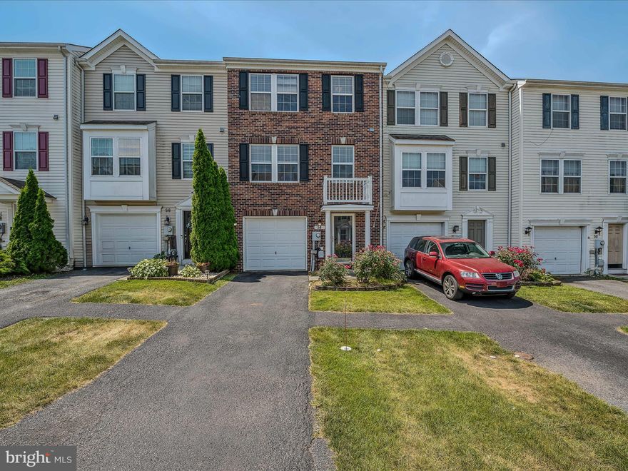 This brick front townhome features 3 finished levels, 4 bedrooms, and 3.5 baths. A long driveway provides extra parking outside your 1 car garage. Inside you have a spacious foyer with vinyl floors and a large guest closet for storage. The rest of the lower level is fully finished into a massive, carpeted bedroom. This space would also make a great family room, rec room, or a home office. Here you have a ceiling fan and recessed lighting. A sliding glass door provides access to your fenced rear yard. There is a full bath with single bowl vanity and tub/shower on this level. Finally, we have the laundry room to keep your machines tucked neatly away. Up the stairs we find ourselves in the large kitchen. Its granite countertops of accented nicely by the raised panel cabinetry. The space features a nicely sized pantry, updated appliances, and vinyl floor. The large island includes breakfast bar seating for two. The kitchen is open to the dining room. The vinyl floor carries into this space which features chair rail molding. When we move past the kitchen dining we have the morning room. Here you have vinyl floors, a decorative light fixture and tons of natural light. The sliding glass door provides access to you large deck. The deck features nice views and provides the perfect setting for sunbathing or BBQing. On the other side of the kitchen, we have the vast living room. It features lovely hardwood floors, recessed lighting, and large windows. There is a powder room on this level with a pedestal sink. Up the carpeted stairs we have a hardwood hallway leading to two generously sized bedrooms. Both feature carpet, closet storage, ceiling fans and vaulted ceilings. Such lovely details not always present in townhomes. The hall bath includes vinyl floors, a 42 in single bowl vanity and tub/shower. The large primary suite features carpet, ceiling fan, and lots of natural light. It includes a private ensuite with ceramic tiles floors, a large soaking tub, corner shower, and double bowl vanity. The suite is topped off with a huge walk-in closet. You will want for nothing in this space. This home has everything you have been looking for and more! Schedule your showing today!