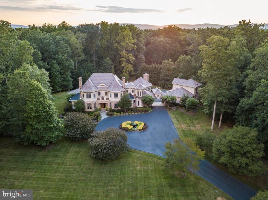 This is your opportunity to live in your own private, wooded getaway in the coveted neighborhood of Piedmont Riding Club. Not only does the exterior brick, stone, and stucco make you feel reminiscent of the French countryside, but the beautiful landscaping and pond make this 12+ acre property a perfect location for wildlife. Not only is the exterior something only fairytales are made of, but the 7,700+ sq ft interior immediately demonstrates that no expense was spared. A completely custom 5 bedroom, 6.5 bathroom home by Seville Custom Builders, this one-of-a-kind property boasts beautiful cherry hardwood flooring, high 10'+ ceilings throughout, 5 fireplaces, a butler's pantry, two offices, multiple wine fridges, a wine cellar, and an in-law/au pair suite. Walk into the front entrance, and you'll be greeted with the grandiose curved staircase, Cristal light fixtures, 2-story foyer,  and open floor plan. It's the perfect home to host holiday gatherings and large parties. But the heart of the house is the kitchen. The star is a four-oven AGA range (over $18,000), which is commonly used by highly renowned celebrities such as, Martha Stewart, Jamie Oliver,  Mary Berry, Paul McCartney, and The Queen of England.  Other appliances include Subzero refrigerator, Miele, and KitchenAid appliances, this is everything a chef could dream of.  No vacation planned? No worries. This home has a resort-like ambiance with a saltwater pool, covered patio, large deck, outside BBQ & fridge, and outdoor living areas perfect for entertaining or embracing a "staycation" during quarantine. Over $900,000 in upgrades and renovations since 2005. If you want to live in elegance & luxury, this is your one-of-a-kind opportunity to own a completely custom home.Video Located here: https://player.vimeo.com/video/442025314 3D Matterport located here:https://my.matterport.com/show/?m=h2KKmvwz5Tt&mls=1