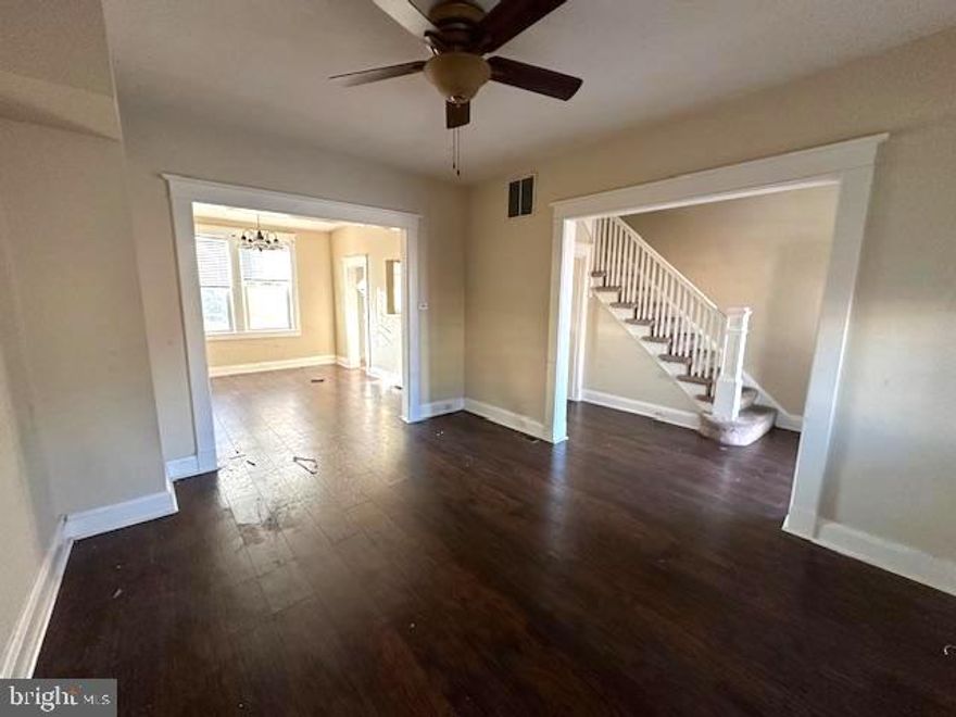 SPACIOUS UPDATED ROWHOME WITH 3 FINISHED LEVELS OF LIVING SPACE AND OFF STREET PARKING!  Main level with a living room, dining room, and kitchen, upper level with 3 bedrooms & 1 full bath, a finished basement with a family room or 4th bedroom, 2nd full bath, storage space, and off street parking for 1 car.  Property is being sold as-is - seller will make no repairs.