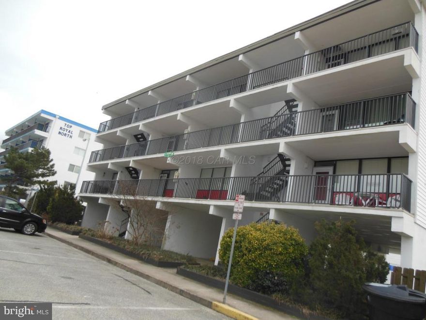 Top Floor unit with beautiful Ocean Views No one above you for quiet enjoyment on the covered Patio. Unit being sold fully furnished and turn key ready for great  rental income already on the books. Pergo floors in living & Kitchen area with several built in's for additional storage.Close to North Side Park for more family activities. 2 assigned parking spaces & downstairs storage.