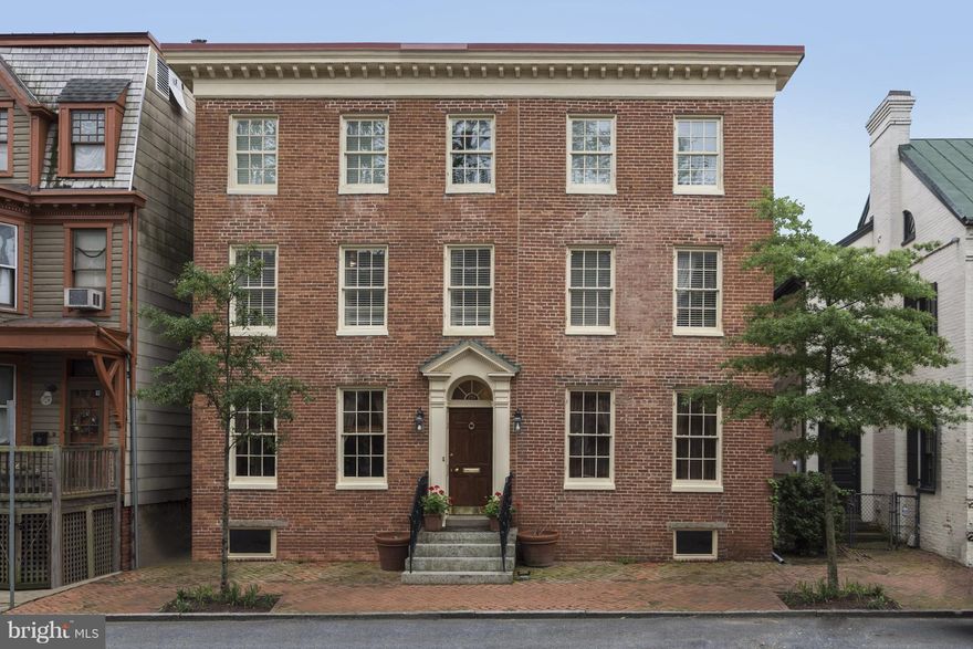 One of a kind elegant oasis in the center of the Historic District!2 lots w/private gated entrance on East St. leading to lg.garage,lots of extra parking,greenhouse,secret garden.Lovely detail-beautiful built-ins,arched doorways,fine molding&doors.Charming spacious bedrooms,all ensuite,good closets&sitting areas.Brick exterior,updated systems thruout.Rm for elevator.Steps to restaurants & shops!