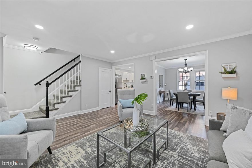 Welcome to 806 N Chapel Gate Lane! This updated inner-row townhouse offers 3 bedrooms, 2 bathrooms and approximately 1,890 square feet of living space. The front porch welcomes you inside to the light-filled living room that features new vinyl flooring, crown molding and recessed lighting throughout the entire main level.  Connected is a formal dining room and kichen that has been fully remodeled and features brand new stainless-steel appliances, upgraded countertops, modern fixtures & hardware and a herringbone style backsplash. All 3 bedrooms are on the second level- including the large primary bedroom and a fully renovated spa-like bathroom.  The finished basement in the lower level features an updated full bathroom, a large walk-in closet and plenty of storage area. The backyard features a shed and room for a private parking pad. 2 year old roof, new sump pump, new front awning and modern finished throughout this lovely home. Great location- close to I-695, I-70, Route 40 and plenty of shopping! You won't want to miss out on this amazing opportunity to own a truly move-in ready home for under $300k! Schedule your showing today!