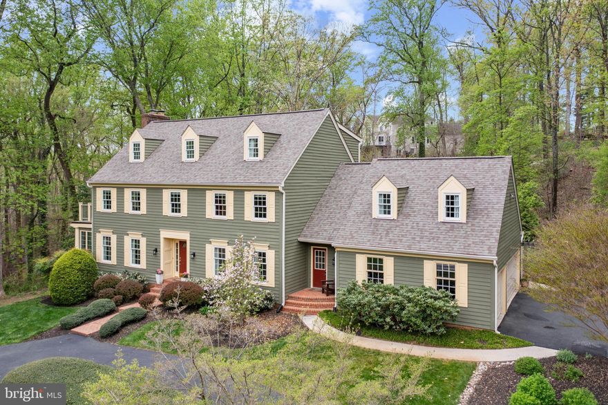 Classic Colonial with a light and airy coastal feel! Immaculate home is in the sought-after waterfront community of Downs on the Severn, offering a gorgeous new marina with boat slips available and a community pool and clubhouse. Let the summer fun begin!.  This stunning home is set on a quiet cul-de-sac and backs to private woods and offers winter water views of Clements Creek. The home welcomes you with a bright foyer and an elegant and tastefully-designed formal living room and formal dining room. The updated kitchen features an island with seating and a dining area and opens to a family room with soaring ceilings. The stunning stone fireplace w/ hearth will light up cold winter evenings! The wall of windows and double sliders to the deck frame a spacious and light-filled room overlooking an ever-changing natural setting. The bright bonus sunroom off the living room can work as an office, reading room, or play space with peek-a-boo glistening water views. The second floor features four bedrooms plus a flexible loft space with access to a deck and a second-floor laundry. The primary bedroom features high ceilings with skylights (w/ remote blinds) and space to accommodate a private sitting area. Multiple closets include a dedicated cedar closet. A secondary set of stairs to the first floor offers easy access to the kitchen and the secondary entry area. The gorgeous primary bath has been elegantly updated with a free-standing soaker tub, double sinks, and a large glass shower. The third floor features a guest suite with a full bath plus an expansive bonus space, currently used as an office but offers many options.  The basement has a gas fireplace, glass sliders to let in light, a half bath, a wine room, and an exercise space. Outdoor decking with access from the kitchen, and a hardscaped patio with professional landscaping create a private space for seasonal entertaining. The three-car garage faces the side of the home and the multiple driveway areas accommodate several cars. Neighborhood amenities are legendary! The newly-renovated marina has floating docks; pool, clubhouse, and tot lot offer access to water activities and community fun. This area has easy access to Annapolis and major commuting routes.