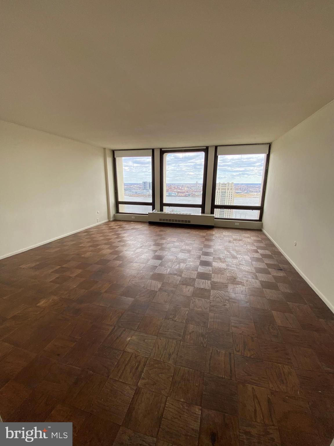 Sun-soaked studio on a high floor of the North tower of Society Hill Towers! This beautifully appointed home features parquet wood floors; a wall of bay windows showcasing captivating river and city views; a separate kitchen with white and black cabinetry, white appliances and white countertops; a full hall bathroom with a shower/tub; and excellent closet and storage space throughout. Residents of Society Hill Towers enjoy a 24 hour doorman, underground parking (for an additional fee, subject to availability), access to the fitness room and outdoor pool for an additional fee, hospitality suite for a fee, on-site Philly Car Share, a coin operated laundry room in basement, an on-site shopping plaza. VIDEO TOUR: https://www.youtube.com/watch?v=AqaPdqa5IJc