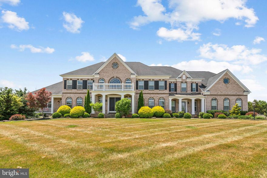 Expansive Mt Vernon model located on a 5.48 acre estate in sought-after Hunters Pond community of Centreville. This 6 bedroom & 7.5 bathroom home with three finished levels offers any luxury imaginable both interior and exterior.  Entering the home you are welcomed into the porcelain tile grand foyer with dual curved stairs.  The open foyer leads to a formal dining room, formal living room, family room, office, full & half bathroom, mud room with storage and gourmet chef's kitchen with breakfast/sunroom. The home offers an in-law suite with a full bath and kitchenette accessible from the main level of the home as well as from a separate entrance.  The main level has custom  walnut floors that were sanded and stained on site. The formal living room was upgraded with installation of a wall of windows, gas fireplace with granite surround and coffered ceilings. The family room has custom shiplap, walnut floors and recessed smart lights. The home has a true chef's kitchen with oversized island with quartzite counters, upgraded pendant lights. 60"  Wolf range with 6 gas burners, 24" griddle & dual convention oven. There is a 36" Subzero Refrigerator & 36" Subzero Freezer as well as a large pantry. The Butler's Pantry offers walnut shelving, cabinets, stone counters with slate backsplash, underlighting, sink & ice maker. Main level laundry room with hook-ups & mud room with built-in storage. The painted oak stairs with iron rails lead you to the primary suite on the upper level along with three additional secondary bedrooms. The primary suite with walnut floors, tray ceiling, smart sconces, floor to ceiling bay window as well as a sitting room with tray ceiling. Huge dual walk-in closets. Primary bathroom offers walk-in/roll in dual shower & dual water closets. All three secondary bedrooms have walk-in closets and full bathrooms attached. Upper level laundry room with Electrolux front load washer/dryer, shelving, cabinets & granite counters. The mostly finished lower level has an expansive rec room/media room, custom bar, workshop, storage and 6th bedroom and additional full bathroom. Bar with refrigerator, ice chest, sink & surround sound system. The workshop has additional electrical 220V. Need space for everyone's toys? The 4 car garage offers ample space with smart door openers (3 of the 4 openers are installed), built-in shelves & vertical platform lift. The expansive backyard offers a patio, multipurpose sport court with inground basketball hoop, raised flowerbeds, 16 zone smart irrigation system, 2 sheds, play ground and play house all which will convey. Entertain on your expansive 2 tier patio with porcelain pavers, limestone steps, pull down shades, smart lighting, 2 ceiling fans, built-in gas grill, pizza oven (AS-IS), fridge, ice chest & vertical platform lift! As you sit on your patio enjoy the pristinely landscaped yard with custom lighting and large garden with sunflowers, fruit trees, herbs, assortment of berries and more.  Additional highlights include: a whole house generator, radon system, UV light + water softener, security system with cameras, 3 wifi access points, multiple TV's conveying & much more! See additional highlights list. The home is on well and septic. The septic is an alternative system for 5 bedrooms and was serviced in 2024.  Too many upgrades to list!