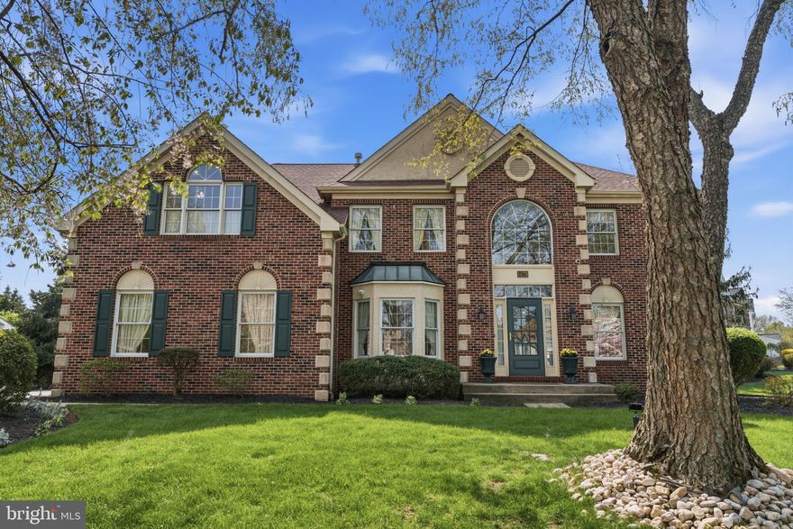 Welcome to this stunning 4-bedroom, 2.5-bath brick colonial where classic craftsmanship meets comfortable living across three beautifully finished levels.

From the moment you arrive, the striking all-brick exterior with quoined corners, arched windows, and lush landscaping sets the tone for the refined details found throughout. Step inside to a grand two-story foyer featuring an elegant curved staircase and rich oak railings.

The formal living room impresses with soaring cathedral ceilings, a brick fireplace, arched French doors, and intricate wall molding details. A dedicated first-floor office completes the main level perfectly.

The kitchen features white cabinetry, granite countertops, stainless steel appliances, and a center island, all set over warm hardwood floors. The real showstopper is the spectacular sunroom addition, a bright and airy vaulted retreat with painted shiplap walls, skylights, dual ceiling fans, and wraparound windows that flood the space with natural light and views of the yard. Whether you are enjoying your morning coffee or unwinding at the end of the day, this space will quickly become the heart of the home.

Upstairs, the expansive primary suite offers abundant natural light and generous space, accompanied by three additional well-sized bedrooms. The finished lower level adds incredible bonus space with a large open recreation area, perfect for entertaining, hobbies, or a home gym.

Located in the desirable Fairfield at Farmview community, this home offers a rare blend of traditional character and everyday functionality. Truly a gem.