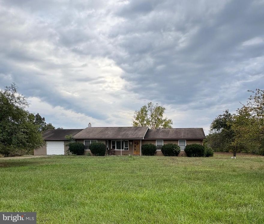 1.47 unrestricted acres with a 3 BR/2 BA home centrally located to Moorefield and Romney.  Beautiful level lot with space to roam and relax.  1, 686 sq. foot home providing one level living.  600 sq. ft. garage, cellar area for storage,
