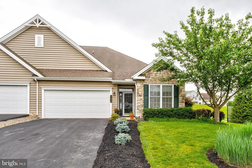 Prestigious Liberty Hill represents a lifestyle, not just a community! This coveted Adams model End Unit features 3 bedrooms and 3 bathrooms, ideally situated with a backdrop of greenspace and the tennis courts adjacent to the clubhouse. The open-concept floor plan features soaring ceilings, 6-foot windows throughout, upgraded hardwood flooring, and a sunroom addition on the first floor, all of which create a bright and inviting atmosphere. Every detail is meticulously considered in the chef’s kitchen, which showcases a large island, granite countertops and backsplash, and ample storage in upgraded cabinets. The great room, with its vaulted ceilings, is open to the kitchen and provides access to an oversized patio complete with a retractable awning. The first floor also includes a gorgeous owners' suite with a huge bedroom with a window seat, a remodeled full bath with a new tile shower w/tile seat and glass surround, and two oversized closets; a well-appointed guest bedroom, a full guest bathroom, a welcoming entryway, a separate laundry room, and access to the finished garage. On the second floor, you'll find a spacious loft area, a large bedroom with a built-in desk and cabinets, a full bathroom, and an oversized utility/storage room with shelving. This home also features a 2-car garage and offers the convenience of one-floor living, making it your dream home! Enjoy the magnificent clubhouse and lifestyle center, which includes a bar/game room, a heated outdoor pool, tennis courts, a media room, a whirlpool hot tub, fitness rooms, and a large lounge/great room with decking and panoramic views of Mt. Nittany, Beaver Stadium, and more!