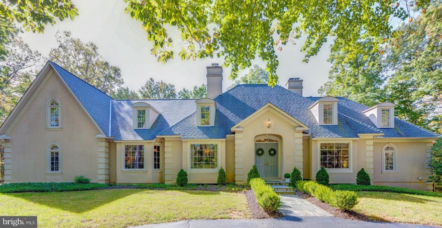 Here you can have it all! Just a few miles from the new Reston Weihle Metro, Reston Town Center and Town of Vienna you will find this hidden gem! A park like setting on almost 3 acres with tennis courts and access to community pond. This custom home has been recently renovated with the assistance of a custom home builder and high-end designer. The close-in location, top rated schools, gorgeous lot, custom design and quality materials make this the perfect home for everyday living or entertaining for years to come!  The interior includes elegant living and dining rooms, a two story library,  a high-end kitchen renovation with marble counters, wood beams in the ceiling, high-end appliances, finished in-place hardwood floors, extended breakfast bar that opens to the family room with stone surround masonry fireplace. The main level master suite is a dream come true with fireplace, spa-like bath, heated floors, stand alone tub, glass enclosed oversized shower and custom cabinetry. The upper level was designed with 4 additional bedrooms, a bonus room, custom floor to ceiling bookcase, upper family room, upper library loft, 3 additional full baths and laundry room. The fully finished walk-out lower level includes a space for everyone! A fabulous great room, wet bar with wine storage,  exercise room, guest suite and full bath.  Madison High School, Thoreau Middle and Flint Hill Elementary.