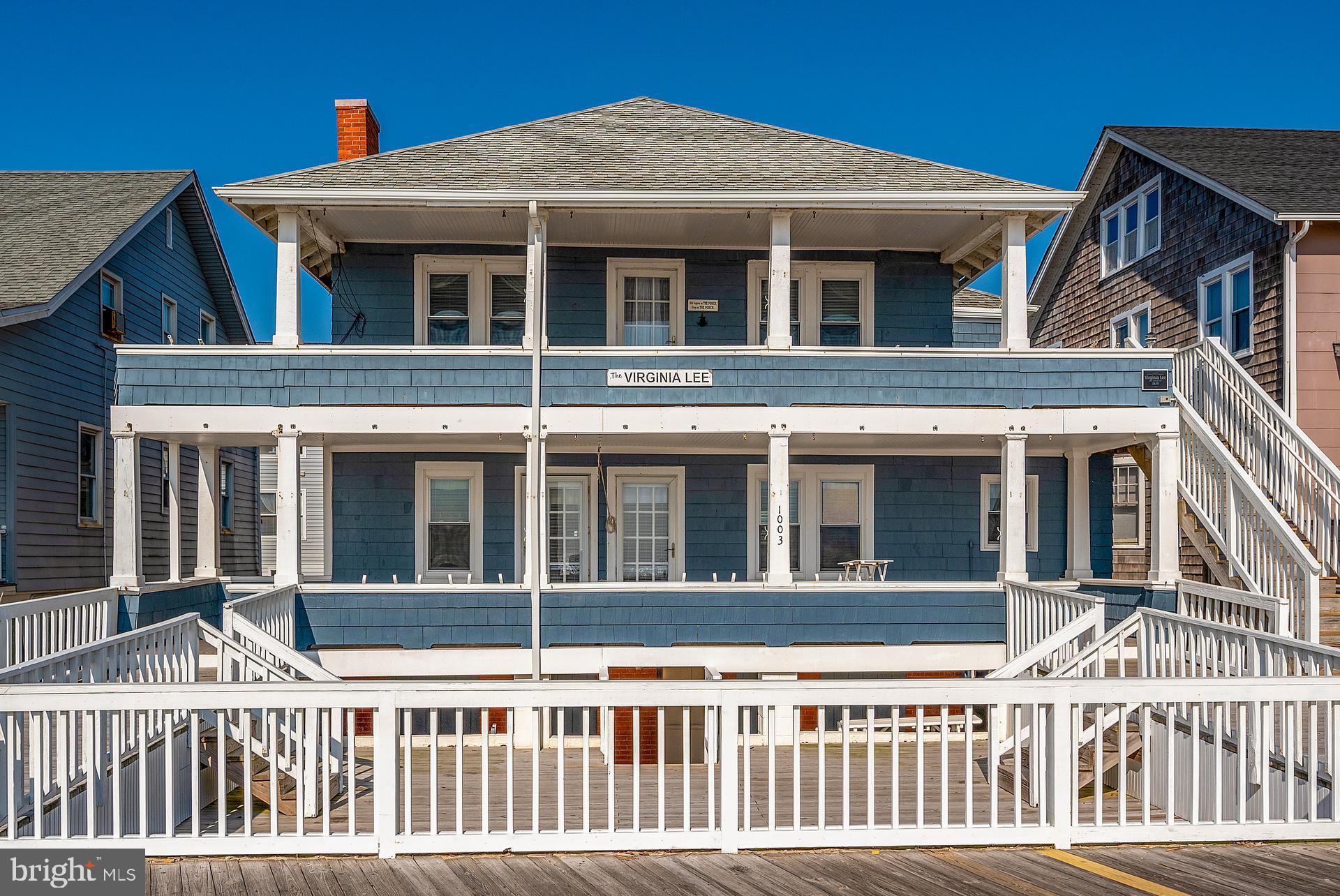 What an unbelievable opportunity to own a direct oceanfront Historic property directly on the Boardwalk in Downtown Ocean City! INVESTOR ALERT for this unheard of chance to own not just the home with 3 spacious units (1st Floor has a 2 bed/1 bath and 3 bed/2 bath, while 2nd floor has a 4 bed/2 bath,) a full and dry basement formerly used for apartments that is now storage and HUGE porches to take in the views, but also a separately deeded and BUILDABLE lot with 9 parking spaces as well! (TAX ID 10-035694) Strong rental history here with the likelihood to do even better numbers! Ample Boardwalk frontage, outdoor hot and cold shower, located in the Opportunity Zone as well. Now is the time to make an appointment to see!