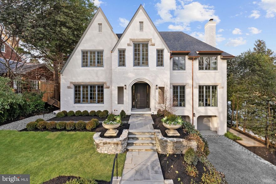 Located in the heart of the estate section of Wesley Heights on a private quarter-acre lot set gracefully back from the street, 4433 Cathedral Avenue is a newly transformed brick Tudor by Madison Investments that masterfully blends timeless architecture with today’s most refined luxuries. With soaring 10-foot ceilings and an exceptional main-level flow designed for elegant entertaining, the home features one of the neighborhood’s largest kitchens and adjoining family rooms—completely rebuilt as part of a top-to-bottom renovation including all-new windows, wide-plank flooring, mechanical systems, chef’s kitchen, and spa-inspired baths.

Additional highlights include a screened porch (ideal for seamless indoor-outdoor living), a sun-filled walkout level opening to expansive flagstone terraces, and a spectacular mudroom with custom built-ins and laundry directly off the two-car attached garage. The private owner’s suite is a true retreat, offering two custom walk-in closets, a luxurious oversized bath, a cozy fireplace, and a dedicated office.

Spanning approximately 9,570 square feet across four beautifully finished levels with 7 bedrooms, 6 full baths, and a powder room, the residence is complemented by manicured gardens, mature trees, and multiple outdoor entertaining terraces. This extraordinary Wesley Heights offering delivers estate-level scale and sophistication just moments from neighborhood dining, boutique shopping, and Horace Mann ES.