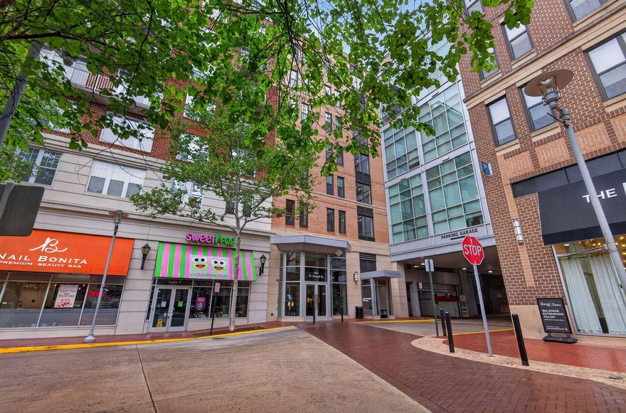 Outstanding 2br / 2ba unit in the sought-after SPECTRUM.  TOTALLY RENOVATED and in LIKE NEW condition w/ new floors & paint.  Gourmet kitchen w/ refinished cabinets, stainless appliances, and granite counters.  LIGHT FILLED south-facing balcony with wide open views over trees and other buildings.  Full size washer/dryer IN UNIT.  Both bedrooms have large walk-in closets, and primary bedroom has large soaking tub and separate shower.  TWO assigned parking spaces (#97, 98).  Large storage unit DOWN THE HALL from the property.  Located in the heart of Falls Church city in an outstanding mixed-use complex with restaurants, stores, and bars on the lower level.