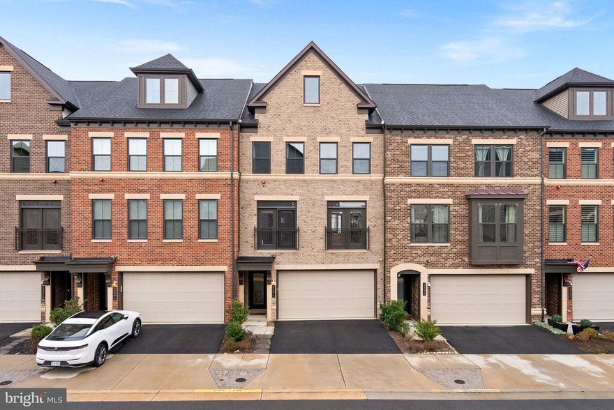 Welcome to 22276 Cornerstone Crossing Terrace located just minutes from the Silver Line Metro Station! This stunning 4-bedroom, 4.5-bathroom townhome, rarely available front load garage, offers modern living with a touch of elegance.   The moment you step inside, you'll be captivated by the many custom built-ins throughout the main level and high end finishes.   The lower level has recently installed LVP flooring and a full bathroom, perfect for entertaining or relaxing.  The main level is the epitome of open concept living.  There is a seamless flow from the formal dining room to the oversized island of the gourmet kitchen to the spacious family room.  The 3rd level offers the primary bedroom with attached spa like bath and walk in closet.  There are 2 secondary bedrooms, spacious laundry room with sink and a large full bath.  The 4th level is perfect for more entertaining.  There is a large rec room and 4th bedroom or home office, plus an additional full bathroom.  Enjoy cocktails or coffee on the roof top terrace.  Convenience is key with this property, located less than a mile from the metro. Don't miss out on this incredible opportunity to own a home that combines style, comfort, and convenience as well as the amazing amenities of The Westmoore Community.  Come experience all that 22276 Cornerstone Crossing Terrace has to offer!
