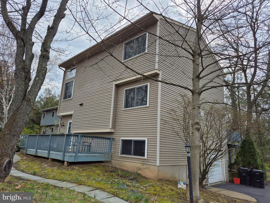 Tucked away on a beautiful tree-lined lot within State College Borough, this contemporary-style home offers a peaceful retreat with everyday convenience. The spacious main floor welcomes you with a warm & inviting living room featuring a cozy wood-burning fireplace & sliding glass doors that opens to a deck overlooking the serene backyard, perfect for relaxing or entertaining amongst the trees.  Enjoy a delightful dining room & a fully equipped kitchen complete with included appliances & a charming breakfast bar, ideal for casual meals or morning coffee. Upstairs, the private owner’s suite features its own full bath, while 2 additional bedrooms & a second full bath provide comfort and space for family or guests.  The walk-out lower level boasts a large rec room that’s perfect for game day gatherings or movie nights. Additional highlights include a convenient first-floor half bath, a separate laundry room with included washer & dryer plus a handy utility sink located on the lower level & an integral 1-car garage.  Located in a peaceful setting with unbeatable convenience, you’ll enjoy easy access to schools, local shops, beloved eateries, downtown State College & Penn State University.  This inviting home offers the perfect blend of privacy, character & connection, come take a look for yourself!