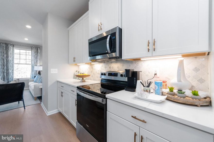 May/June Delivery! Fabulous 3 finished level townhome in North Stafford's hottest community! Featuring 2 car garage, 3 bdrms 3.5 baths; Gorgeous open layout w/Rear Kitchen which features center island, ss appliances, quartz counters, upgraded white cabinetry, and best of all lots of extra cabinet and counter space! Recessed lighting thruout, oak dual staircase, open rails, luxury vinyl plank floors on main level, full walkout from rec room; private rear yard backing to mature trees!!! Walk to shops and restaurants; 2 miles to I-95; 8 miles to VRE. VISIT TODAY!