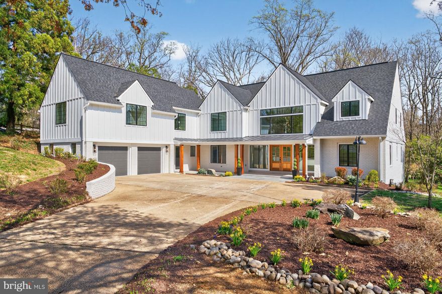 Located in coveted Bradley Hills Grove, 7126 Darby Road is a rare offering consisting of a primary front lot and a continuous parcel behind. The rear of the combined nearly 1-acre property delivers exceptional privacy, phenomenal views, and ample space for a swimming pool and more. From its lower edge, the sights and sounds of the neighboring creek can be enjoyed. Itself extraordinary, the home has just undergone a remarkable transformation and expansion. Awaiting the new owner is more than 7300 square feet of impeccable living space apportioned over four fabulous levels. With 8 bedrooms, 7 full, and 2 half bathrooms –inclusive of the dazzling, full 1BR/1BA apartment above the garage— this residence offers an unparalleled lifestyle and is perfectly suited to large scale entertaining as well as multigenerational living. Oversized windows and walls of glass bring the outdoors and sunshine in where satiny hardwood floors, a fresh consistent color palette, floor-to-ceiling fireplace surrounds, vertical slat wall accents, and a curated tile selection set a modern, uplifting tone. The open main level stuns with its immaculate two-story foyer and dramatic staircase, elegant dining room with statement lighting, sunken living and family rooms with sliding and multi-fold glass doors, center island chef’s kitchen with a large walk-in pantry, breakfast area with a coffee lounge, private corner office, bedroom with ensuite bath, two powder rooms, and a mudroom. Gracing the second level is a spacious primary suite with breathtaking views through the wall of windows, a fireplace, a gorgeous bathroom with a freestanding slipper tub, large glass shower, and a double vanity, and 2 walk-in closets. Completing this level are two additional spacious bedrooms each with beautiful ensuite bathrooms, a laundry room, and access to the full guest apartment and back staircase. The bright uppermost level provides more stunning views, a large loft sitting room, two spacious bedrooms, and a full bathroom. Downstairs, the walk-out lower level offers an expansive recreation room with glass door passage to a covered terrace, the eighth bedroom, the seventh bathroom, a large exercise room and vast storage space. Wonderful exterior features include a full width covered portico and mahogany double entry doors, an expansive flagstone terrace across the rear, an attached 2-car garage and large motor court, and lovely landscaping. Just around the bend from the Burning Tree Club, in the Burning Tree/Pyle/Whitman school district, and convenient to downtown Bethesda, Washington DC, and major travel routes, this location is superb.