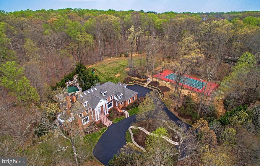 Timeless Estate Living At Its Best in Great Falls!!
Twenty-four hours' advance notice is required.
 Estate with Private  Entrance Gate, Swimming Pool, Spa, Tennis Court & Diamond Field. This magnificent estate offers a rare opportunity to own a grand residence nestled on five scenic acres in the prestigious enclave of Great Falls. Surrounded by lush woodlands and manicured landscaping, the property seamlessly blends timeless elegance with modern comfort, making it an ideal retreat for those seeking privacy, luxury, and proximity to urban conveniences.

🏡 Property Highlights
• Sold As-Is: Renovations are Complete, no further updates will be made.
• Newly Completed Features:
• Private New Tennis Court
• New elegant brick columns  with lights at the entrance gate
• Newly installed  Roof
• Refreshed landscaping and multiple other upgrades
•  Freshly painted front entrance door and window shutters 
✨ Interior Features
•  9 spacious bedrooms and nine and a half bathrooms, ideal for multi-generational living or hosting guests
• Open-concept kitchen and family room with abundant natural light, perfect for everyday living and entertaining
• Master suite with a gas fireplace and a private balcony, offering tranquil views and a serene space to enjoy your morning coffee or to unwind
New A/C unit installed in August 2025

🌿 Lifestyle & Location
• Located in a quiet, wooded setting that offers seclusion without sacrificing convenience
• Walking distance to the renowned French restaurant, L’Auberge Chez Francois
• Minutes from Potomac River, the renowned Great Falls Park, and scenic hiking trails
• Close to Great Falls Village Center for boutique shopping, dining, and cultural experiences
• Zoned for top-rated pyramid schools and part of a highly sought-after community

This estate is more than a home; it’s a statement of architectural excellence and refined living. With its grand façade, gated entrance, and expansive grounds, it offers unmatched curb appeal and a lifestyle of distinction.

📞 Don't hesitate to get in touch with the listing agent to schedule a private showing.