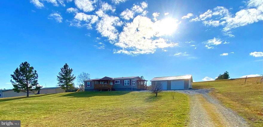 Conveniently Located 5 Miles Out Of Town In A Country Setting. This, move in ready, home has been very well maintained as the owner's upkeep with the preventive maintenance is clearly recognized.  With 3 bedrooms, 2 full baths, kitchen, dining, huge living and laundry rooms there is plenty of room for everyone. Great home to entertain in. The owner's suite boosts a large walk-in closet with a private updated spacious bath. Not to Mention the  Added bonus of a 24 x 30  detached 2 bay garage. Has a big front yard with views that will knock your socks off! Fresh air at its finest. Highpoint consist of some of the most genuine folks you will ever meet. Centralized with short distances to national forest, fishing, skiing, hiking, hunting, caving and lots of numerous adventures the Potomac Highlands has to offer. Lois Lane Welcomes You.  Call me for your very own private tour.