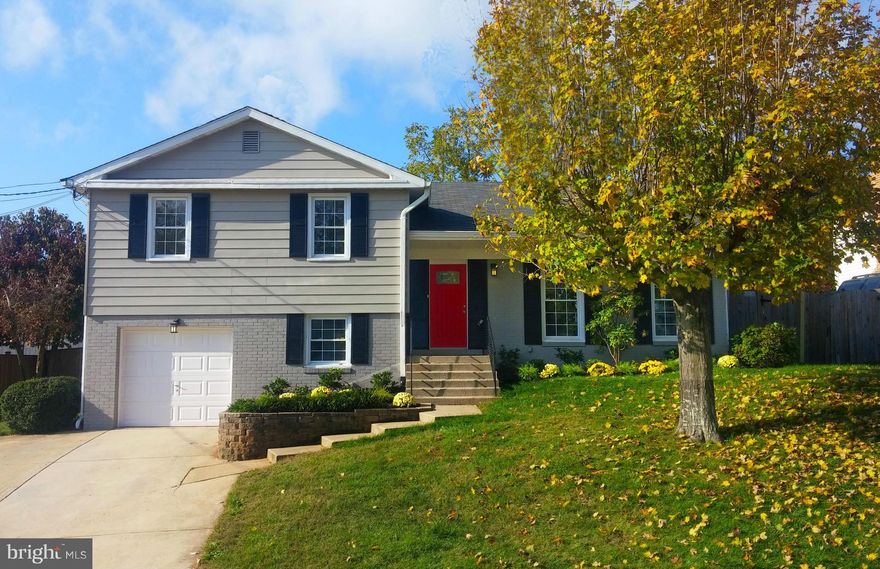 Amazing renovation with an eye for detail.  Huge 4 level split with over 3200sf of living space! Open gourmet table-space kitchen offers soft close shaker cabs, high-end stainless appliances, porcelain floors & granite counters.  Real hardwood floors and crown moulding through ample living and dining room. Beautifully redone baths w/ porcelain and stone. Pool completely redone and open. Enjoy!