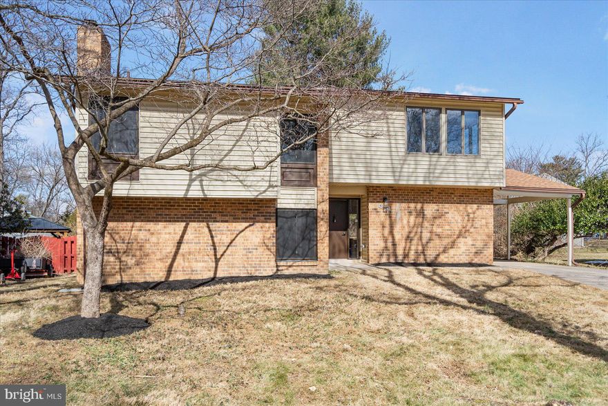 Stunning fully renovated 5BR/3BA split level home featuring three floors of living space in the quiet neighborhood of Thunder Hill.  Park just steps from the attached carport and make your way to the front door into your new home. Step into a bright open floor plan boasting beautiful flooring and tons of natural light.  The main floor features a large open living room, a dining room ideal when entertaining, and a stunning kitchen.  The kitchen features accents of mixed metals including black, gold, and stainless in the hardware and lighting fixtures.  Plenty of cabinets including a separate pantry, stainless steel appliances, a deep stainless sink under a window, quartz countertops, and a peninsula with breakfast seating for three or more. Take a few steps down into the family room complete with a brick wood burning fireplace flanked by two large windows, and a newly remodeled guest full bath with a walk-in shower.  On the second level you will find hardwood floors in the three secondary sized bedrooms, one with a walk-in closet, and a newly remodeled full bath.  Up just a few more steps to the carpeted third level featuring the fourth secondary bedroom with a walk-in closet, and a grand primary suite.  The primary features his/hers closets and a gorgeous en suite boasting a double sink vanity and a beautifully tiled walk-in shower.  From the living room, open the sliding doors to a yard filled with tons of green space, a patio, and so many possibilities.  This home is move-in ready with so much to offer new homeowners and is located in close proximity to shopping, restaurants, and commuter routes.