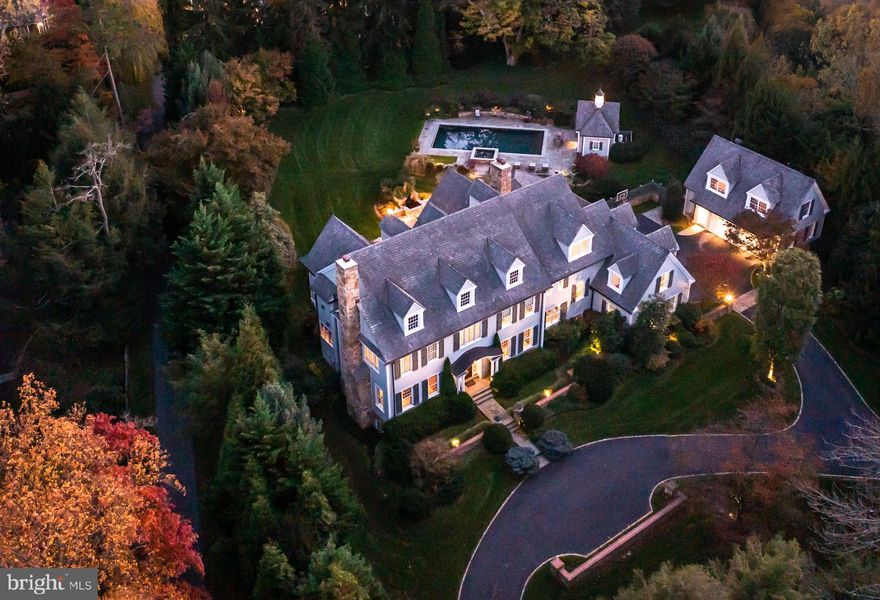 A cool, ‘New classic’ w/ one of the most well-considered & smartly delivered interior plans in arguably the most highly prized location in all of Radnor township. 25  Orchard Lane, offers the hard-to-achieve blend of warmth through expertly selected finishes such as character grade flooring, hand-hewed beams, reclaimed wood doors as well as engaging contemporary elements including large format tile, chic lighting & bright connected spaces. A generous fireside formal LR & elegant DR flow from the wide Center Hall. Fully paneled, & positioned off the back of the house a handsome Library/Office glows with an embedded saltwater aquarium on one wall & a gas fireplace on the other. Cross the  Foyer & Hall to the stunning custom Kitchen, Breakfast Rm & vaulted ceiling Family Rm. In the Kitchen, rich, contemporary profile cabinets & stone counters meet the slightly iridescent backsplash creating a sophisticated but immediately welcoming space. A suite of highest level appliances (double Wolf ovens, two Bosch dishwashers, 6 burner Wolf gas cooktop, Sub-Zero refrig &freezing) forms the perimeter, surrounding a spectacular oversized seated island. Additional storage & utility are found in the Walk-in Pantry, another wall of cabinetry & under-counter wine chiller. Steps away & brightened by custom windows & french doors, the Breakfast Rm features a peaked ceiling  & opens to a dramatic Family Rm w/ floor to ceiling stone fireplace, custom shelving & outside exit to the sweeping rear stone terrace. W/ an eye towards organization & demand for at-home workspaces, 2 different Family Offices are located off the Mudrm/Garage entrance. One office is designed w/ two desks on either side of a wide window & the other enjoys views of the Courtyard & features a custom dog door & walk-in closet, ideal for concealing printers & supplies. A full Laundry w/ dog bath, Costco-sized storage closet & “Bike room” from the attached  2 car Garage underscore the superior & informed design of the home. Embracing as much natural light as possible the house was carefully oriented to showcase its 'Outdoor Rooms’. The Covered Terrace is charmed by a wood-burning fireplace w/ the addition of overhead heaters extending the use of this space deep into the winter. A built-in grill is adjacent to the Dining Patio which overlooks a recirculating fountain & goldfish pond. Positioned on a slight rise, is the sparkling salt-water Pool & separate Spa. A standalone Pool House reflects the architecture of the main home w/ cupola, & sliding barn-style doors. A serving area, full Bath & Storage are the function side of this charming structure, set against the backdrop of privately & professionally landscaped grounds & irrigated gardens. Ascend the front Stair to the Primary Suite. A calm, neutral color palette, sleek linear fireplace, two exposures of light &volume ceiling combine to create an inviting & relaxing space. A large Bath offers separate custom vanities, two w/ sinks & one seated make-up area, warmed by radiantly heated stone floors w/  both a seated Shower & large under-window Soaking Tub. Exceptional storage are found in the walk-in Primary Closet. There is no need to move clothing w/ the seasons…there is a place for everything! 4 additional Family or Guest rooms, each w/ their own bath & each w/ professionally outfitted closet systems are accessed off a wide hall & make use of either the front or rear stair. Designed for both work & ply the Lower Level extends the casual living space offering a large open Recreation Room, a television area  & a daylight Gym.A large full Bath, Mechanical & Storage are also on this floor. Other important features of the home and location…Flanking the courtyard is another 2 car Garage. The space above is electrified & plumbed but unfinished, awaiting the next owner's needs. The Radnor trail is located just across Orchard lane and downtown Wayne is >2 miles.  Pristine, Turn-key, Exceptional in all ways. By appt only