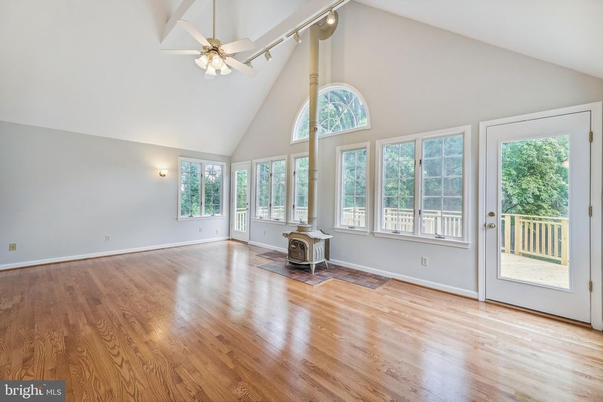 TOTAL CHARMER! Open Saturday 1-3 PM! Welcome to this stunning bungalow in trendy Douglas Park! This beautifully updated 4 bedroom, 2 ½ bath home is larger than it looks!  It boasts newly refinished hardwood floors, bathrooms which have all been fully renovated within the last 5 years, and a large lot backing to parkland.   The oversized great room features a cathedral ceiling, a wood burning stove, and a wall of windows and French doors out to a NEW deck. Relax on the NEW deck in total privacy. The deck overlooks a large, flat, fenced yard backing to a treed portion of Douglas Park.  The living room exudes charm with its built in bookcases and an antique mantle surrounding the original wood burning fireplace. The current owners added a second bedroom to the first floor and it additionally includes a flex space which could be used as a library.  The main floor bath was fully renovated in 2018 including a new claw foot tub.  The formal dining room sits at the front of the home adjacent to the updated kitchen which features a  Bosch dishwasher(2020), a built in microwave, and an LG refrigerator (2021). The fully finished basement is newly carpeted and offers a walk-out fourth bedroom—perfect for a home office, a recreation room, a den, and a newly renovated half bath (2022).  Upstairs enjoy the private primary suite and newly (2021) renovated primary bath.  Other significant updates include: Roof (2014), Deck (2022), A/C (2019), Washer/Dryer (2022), Water Heater (2014).  Did we mention location? With easy access to I-395 this home is a commuters dream.  It sits near the Columbia Pike Corridor and close to Shirlington and all the dining and entertainment it offers. This home won’t last!