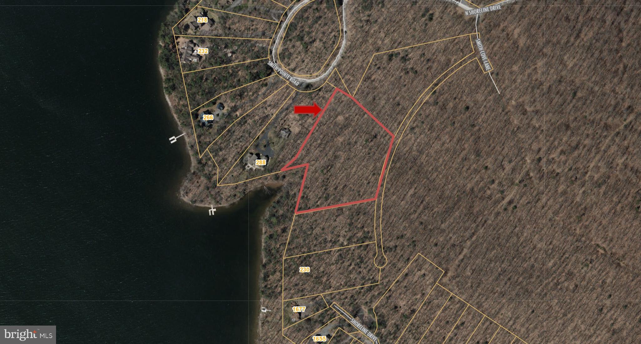 One of a kind, premiere, level lakefront estate building site with approximately 5 acres of wooded privacy and nearly 300' of protected shoreline. Located in the highly desirable Smith Pointe/Back Of Beyond subdivision in Thousand Acres, the gently sloping lakefront lot is uniquely protected from power boat traffic with plenty of water depth for your private type A dock. The gently sloping lakefront site is easily accessible regardless of the season and offers public sewer and underground utilities.
The property is also located within a few miles of the incredible 5 star Thousand Acres Golf Club, with available membership opportunities for property owners.