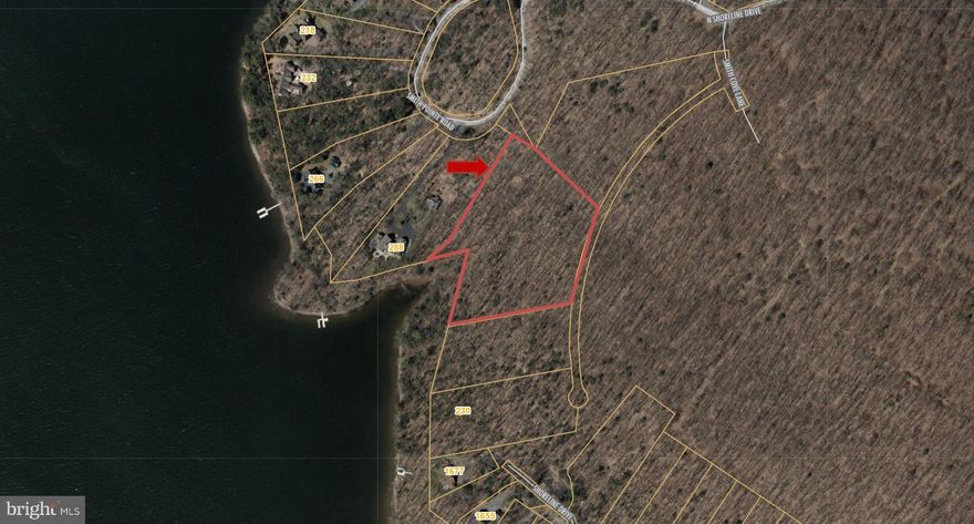 One of a kind, premiere, level lakefront estate building site with approximately 5 acres of wooded privacy and nearly 300' of protected shoreline.  Located in the highly desirable  Smith Pointe/Back Of Beyond subdivision in Thousand Acres, the gently sloping lakefront lot is uniquely protected from power boat traffic with plenty of water depth for your private type A dock.  The gently sloping lakefront site is easily accessible regardless of the season and offers public sewer and  underground utilities.  

The property is also located within a few miles of the incredible 5 star Thousand Acres Golf Club, with available membership opportunities for property owners.