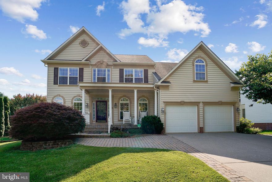 Located in beautiful Hobbits Glen golf course community, this sought-after transitional Colonial with two owner's suites is perfectly situated on a spacious lot and shines with pride of ownership throughout.  Main level living begins with an inviting entry foyer complemented by decorative columns and boasting a two-story overlook.  The formal living room and dining room greet you upon entry.  The tastefully appointed kitchen is a perfect gathering space with features that include ceramic backsplash, granite countertops, new stainless steel appliances, a center island, and separate breakfast space.  The kitchen opens to a large comfortable deck with peaceful views of mature trees and the spacious backyard.  The adjoining family room dazzles with two-story ceilings and an eye-catching stone stacked gas fireplace with natural light flowing through abundant windows.  Home offers a highly-sought after main level owner's bedroom with a striking upgraded owner's bath .  The powder room and large laundry room complete this level.  The upper level features a second owner's suite with newly updated hardwood floors and a lovely bathroom.  Two additional bedrooms, one oversized could easily be converted to two separate bedrooms.  There is also a center hall bathroom.  The lower level includes an exceptional recreation area for entertaining with a second stone stacked gas fireplace and a built-in bar area.  There is a large private room that makes a perfect office, exercise area or potential 5th bedroom.  The fourth full bathroom is also on this level.  Additionally, an oversized storage room and a walk-out to the patio and fully fenced landscaped yard.  Impressive on the outside and so comfortable on the inside, this home is convenient to shopping, recreation, and major commuter routes.