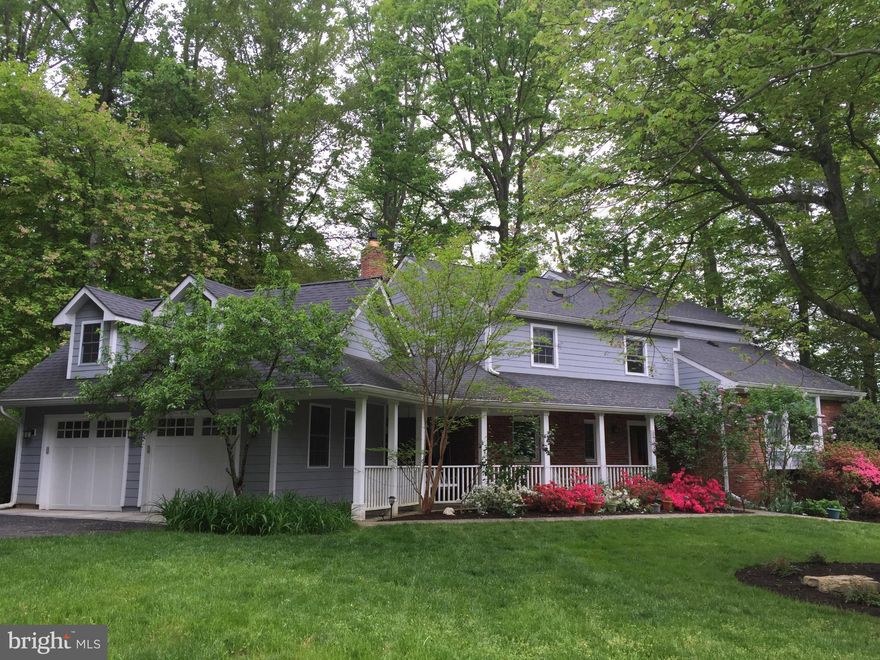 Spacious 4BR, 4.5BA w/great open flr plan, gleaming hardwoods, lg private yard w/mature landscping + lower lvl office & waiting Rm w/sep entrance & full BA. Bright eat-in Kitch w/huge island, SS appls, deck, patio & yard access. Master Ste w/Jacuzzi tub, vaulted ceilings, skylights & loft. 2nd Master w/en suite BA & private deck. Cozy Fam Rm w/fireplace. 2car garage w/lg drive.EstPropTax $11728.52