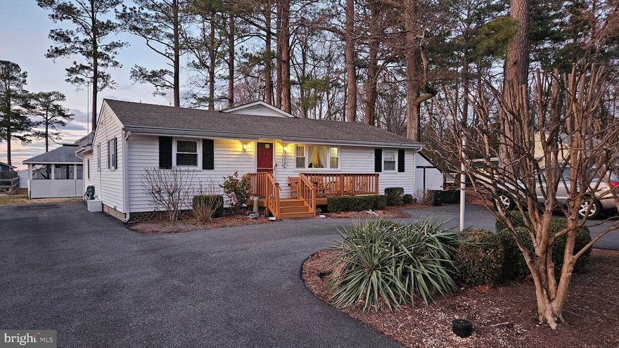 Price reduction plus a $5,000 decorating allowance.  Seize this opportunity to live the vacation lifestyle all the time.  Adjacent to Herrington Harbour South, Rose Haven on the Bay is an amazing community nestled next to the Chesapeake Bay.  The community offers a 2 acre park that gives waterfront access to all as well as a wonderful place for picnics and community events.  This one level cottage appears modest from the front, but is boasts a large addition on the rear and an amazing 2nd story deck that affords you a great water view and breezes off the bay.