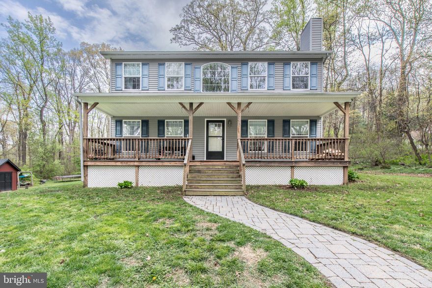 This charming Colonial home, built in 2005, offers a perfect blend of comfort and functionality. Step inside to discover a warm, inviting atmosphere with fully carpeted and wood flooring throughout. Enjoy the convenience of a main floor laundry and a self-cleaning oven, making daily tasks a breeze. With three bedrooms and two and a half baths, including a primary bath, this home is designed for relaxation. Gather around the wood-burning fireplace in the living area, creating a perfect spot for cozy evenings. Set on a generous one-acre lot, the property is surrounded by beautiful trees, offering a serene view and a sense of privacy. The shed offers extra storage. Embrace the tranquility of nature right at your doorstep in this delightful home! This ones for you!!!