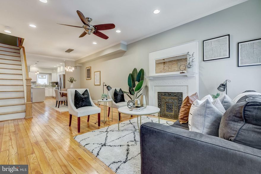 STUNNING 3 STORY HOME LOCATED ON SOUGHT AFTER BLOCK IN CANTON WITH WITH OFF-STREET PARKING PAD. OVERSIZED LOT WITH 2,000+ SQUARE FEET. GORGEOUS RECLAIMED HARDWOODS CASCADE THROUGHOUT. ENJOY WHITE CABINETRY, UPGRADED TRIM AND PAINT PACKAGE, IMPORTED TILE, QUARTZ COUNTERTOPS, SS APPLIANCES IN DESIGNER CHEF'S KITCHEN. LOADS OF NATURAL LIGHT. HIGH CEILINGS. EXPOSED BRICK. TONS OF STORAGE. WALK-IN SHOWERS. WALK-IN CLOSETS. FINISHED LOWER LEVEL. SPACIOUS 4 BEDROOMS WITH 3.5 BATHROOMS. 3RD LEVEL ROOM CAN ACT AS A LIBRARY, STUDY, GYM, OFFICE, OR SECONDARY GREAT ROOM. EXPANSIVE DECK WITH BREATHTAKING VIEWS OF CITY SKYLINE - GREAT FOR ENTERTAINING. DUAL ZONE HEAT/AC. CLOSE PROXIMITY TO RETAIL SHOPPING, LOCAL DINING, PATTERSON PARK, AND ALL MAJOR HIGHWAYS.