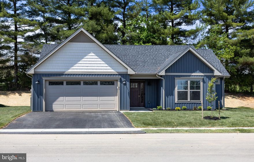 This new construction home is NOW READY for move in, in the new community of Meadow Crest – by Panhandle Homes of Berkeley County.  Located in the Spring Mills community, Meadow Crest is a small neighborhood with sidewalks lining the street and views of trees.  This home backs to a tree line for additional privacy.  Built with low-maintenance in mind, this one level rancher comes with LVP throughout the main living areas, quartz countertops, an open kitchen with a large kitchen island, a step in tile shower in the owners suite and a large covered rear porch.  The home comes with a 1 year builders warranty, Trane HVAC system and public water/sewer with electric appliances.