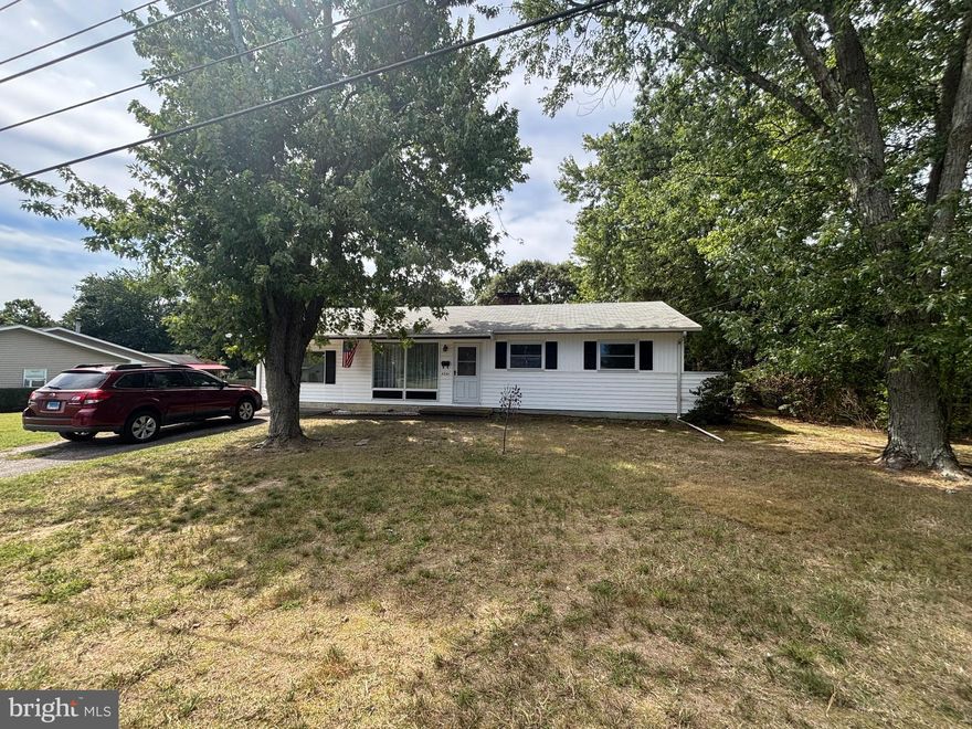 Welcome to 4301 Belle of Georgia. Nestled on a spacious, private lot bordered by mature trees, this warm and inviting ranch-style home offers an ideal combination of comfort, functionality, and timeless charm. Inside, you'll be welcomed by a bright, sunlit interior and a well-designed layout that maximizes both space and ease of living. Lovingly cared for by the same owners for over 50 years, this home reflects true pride of ownership throughout.
The generously sized bedrooms are thoughtfully tucked away in a private wing of the home, offering comfort and tranquility, and are complemented by a beautifully renovated bathroom completed in 2021. The main living areas are warm and inviting, featuring a stunning newly remodeled family room (2025) that’s perfect for both entertaining and relaxing evenings at home. The kitchen and dining areas connect seamlessly, creating an open yet intimate atmosphere ideal for everyday living.
Step outside to a spacious, private backyard that’s perfect for entertaining or relaxing in a peaceful setting. A standout feature is the impressive detached workshop/garage—ideal for hobbyists, car enthusiasts, a home-based workspace, or anyone in need of extra storage. With ample room to expand, the backyard offers exciting potential for an in-ground pool, home addition, or outdoor living area tailored to your vision.
Additional updates include a new roof installed in 2019 and a new refrigerator in 2025.  Located in the highly desirable Chesapeake school district, this home is also just minutes from local shopping, dining, and major commuter routes—making everyday living as convenient as it is serene.