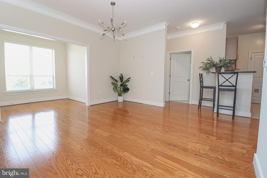 Another opportunity to purchase this Beautiful and Convenient Condo - Own It!!! Cash, Conventional, or Portfolio Financing, etc. may work for this condo. Practically new one level living with resort like amenities. Come on out of the heat, rain and snow as you drive into the covered parking garage on the same level as your unit…Just moments away from entering your fabulous 2 bedrooms 2 baths luxury corner condo home. Upon entry, the gleaming wood floors already makes it feel like home with treetop views from the double windows in the solarium. The spacious living room offers dual crown molding with a modern-retro 10 light sputnik chandelier sure to strike a conversation. The kitchen has maple cabinets, granite countertops, bar seating and stainless-steel appliances with ceramic floors leading to the laundry room – pantry area.  This gorgeous condo home offers the two bedrooms room-mate style layout. The primary bedroom with new modern ceiling fan leads to the connecting office space, perfect for working from home. The en-suite bath and large walk-in closet completes this amazing space. Commercial water heater with copper pipes replaced in 2019. No need for gym membership just take the elevator down to the 1st floor where you will find a recently renovated gym, billiards, yoga room and a business office. Need to cool down? Try the outdoor pool!!! Celebrate special events in the lounge with kitchen and outdoor entertaining space. Tribeca at Camp Springs is located minutes from Branch Avenue Metro Station, Restaurant Row, Joint Base Andrews, National Harbor, MGM, Tanger Outlets, Alexandria, Washington, DC, major highways, and so much more!