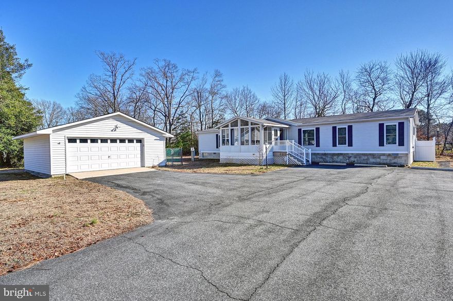 Discover this charming home nestled in the desirable Shadydell Park.  Built in 1997, this Class C residence offers a spacious 1,960 sq. ft. of living space on a generous 0.57-acre lot, situated on a peaceful cul-de-sac. The interior features a cozy wood-burning fireplace,  and a well-appointed kitchen equipped with stainless steel appliances.  The living space flooring has been upgraded with luxury vinyl plank.  Spacious bedrooms with walk-in closets.  The property boasts a detached garage with space for two vehicles, along with additional driveway parking for six.  Shadydell Park is known for its tranquil environment and proximity to local amenities. Residents can enjoy nearby parks, shopping, and dining options, making it an ideal location for those seeking a balanced lifestyle. This property combines comfort, convenience, and a prime location, making it a fantastic opportunity for anyone looking to settle in a welcoming community. Don't miss your chance to make this home your own!